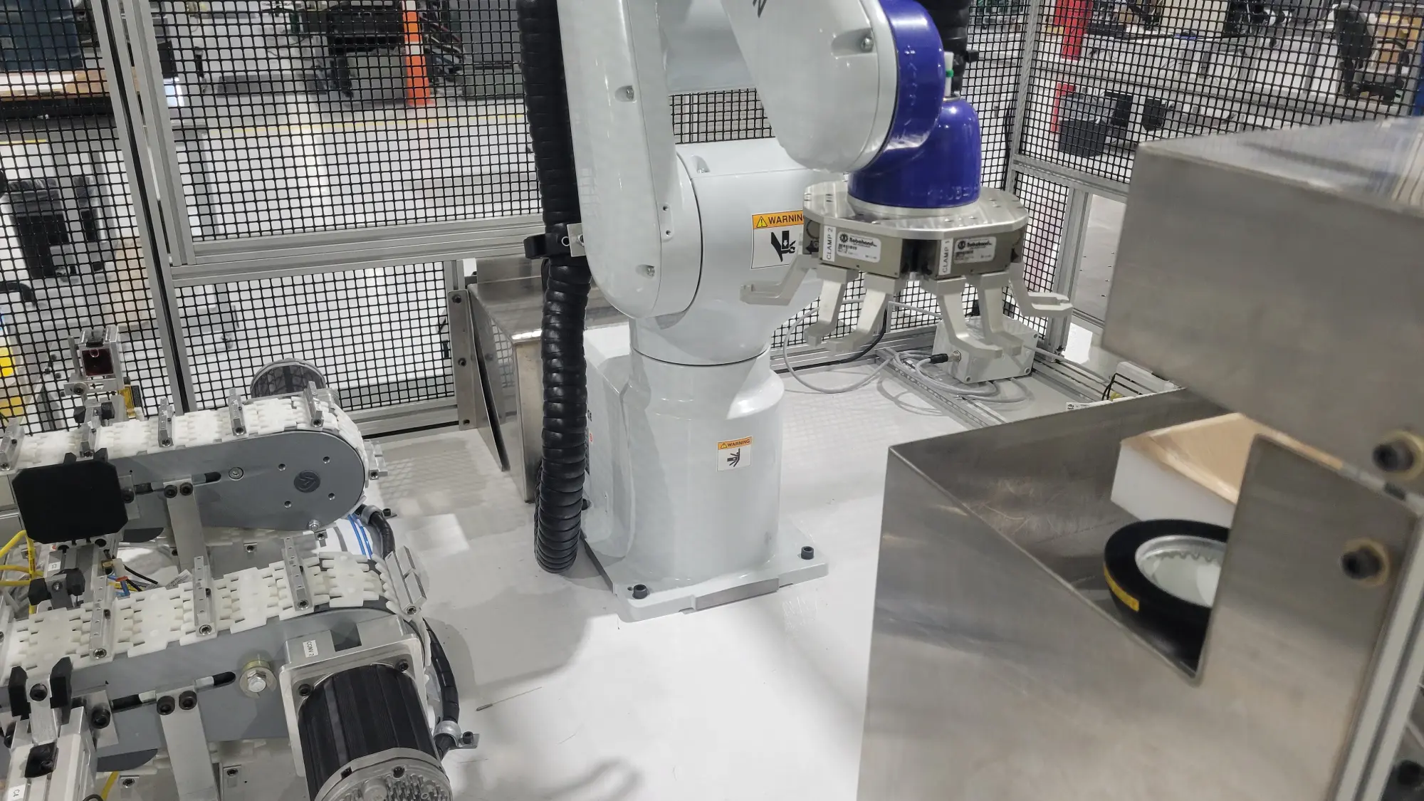 A picture of a custom built machine that uses an Epson VT6 robot arm to inspect fiber optics.