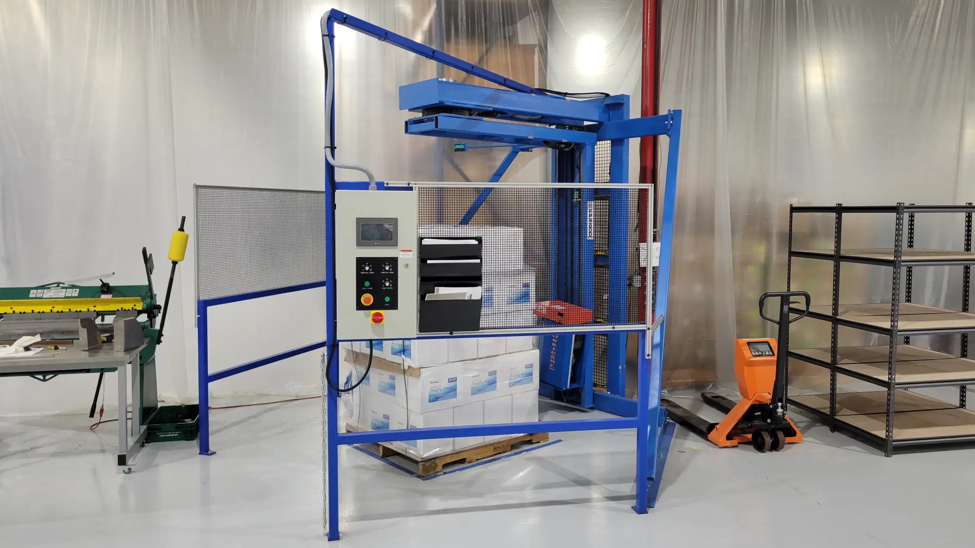 A picture of a pallet wrapping machine.